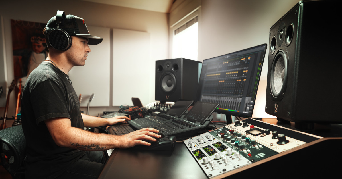 Music producer working at a professional recording workstation